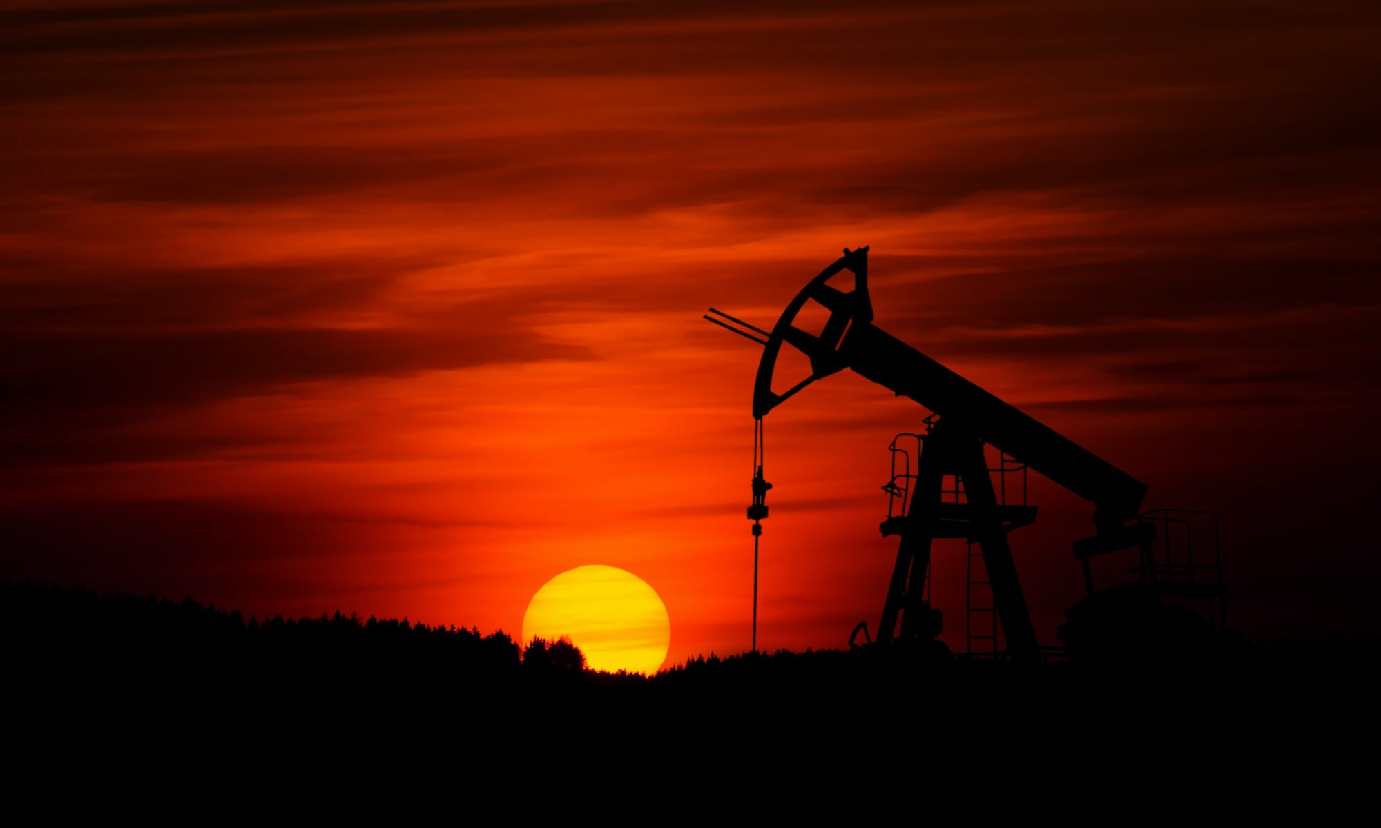 Image of an oil rig by Zbynek Burival via Unsplash.