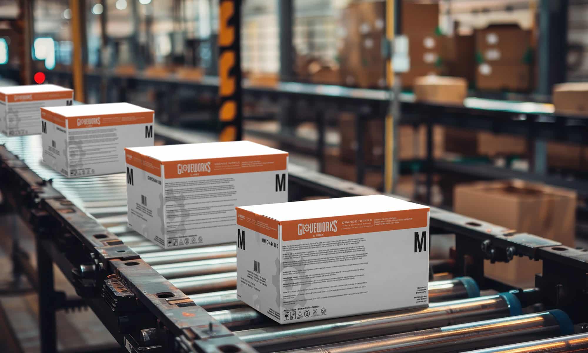 Cases of Gloveworks gloves on conveyor ready for courier distribution